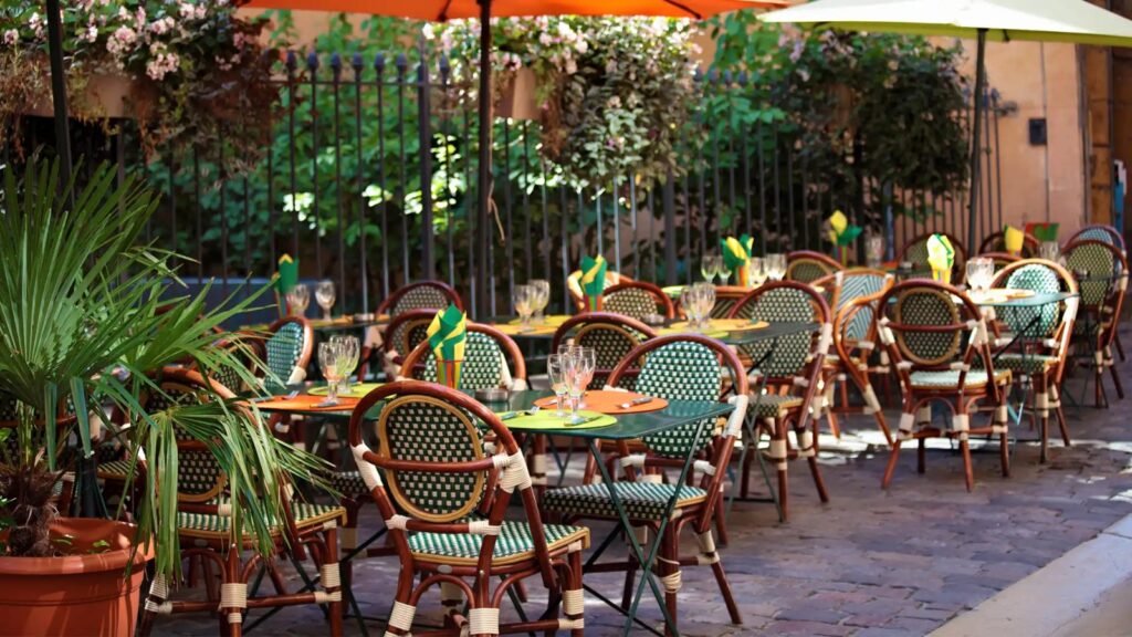 Outdoor restaurant seating with neatly arranged tables and chairs