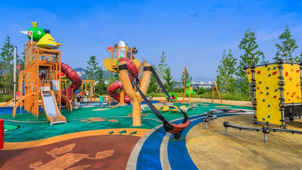 Colorful outdoor children’s playground with slides and climbing structures